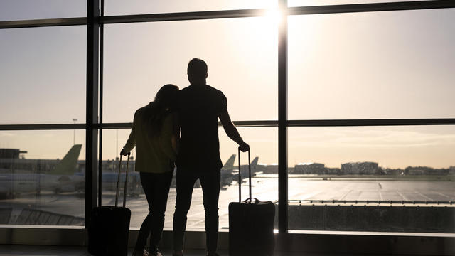 Couple waiting for flight in airport 