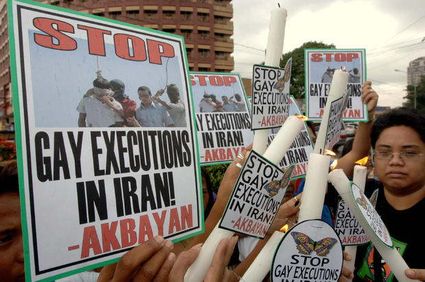 Militant protesters light candles during 