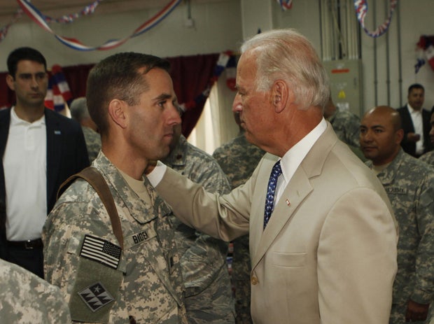 U.S. Vice President Joe Biden (R) talks 