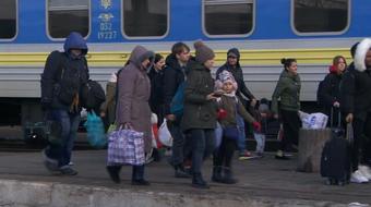 As hundreds of thousands of Ukrainians flee, many stay behind 