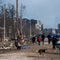 Russians push deeper into port city of Mariupol as locals plead for help