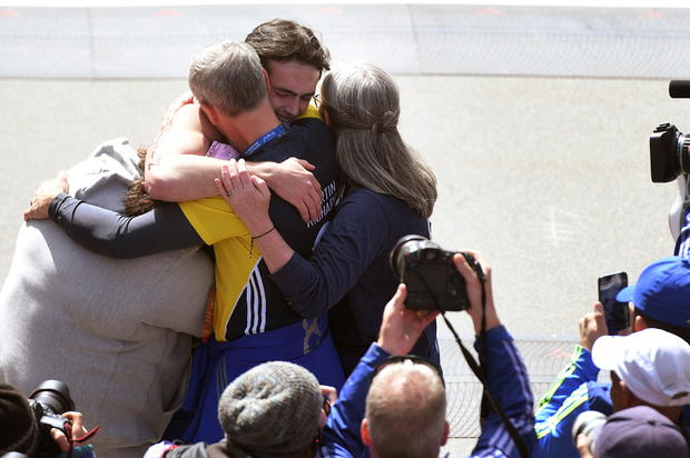 Runners cross the finish line of the 126th Boston Marathon in Boston 