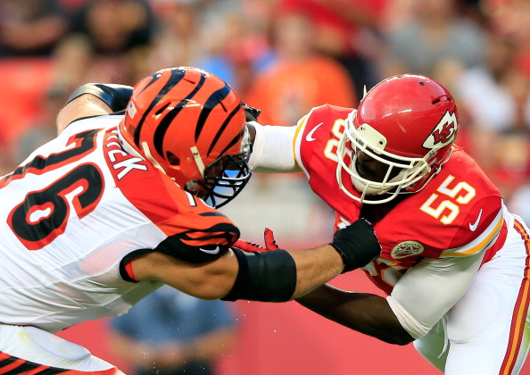 Dee Ford #55 of the Kansas City Chiefs is blocked by David King #76 of the Cincinnati Bengals defends during the preseason game at Arrowhead Stadium on August 7, 2014 in Kansas City, Missouri.  (Photo by Jamie Squire/Getty Images)