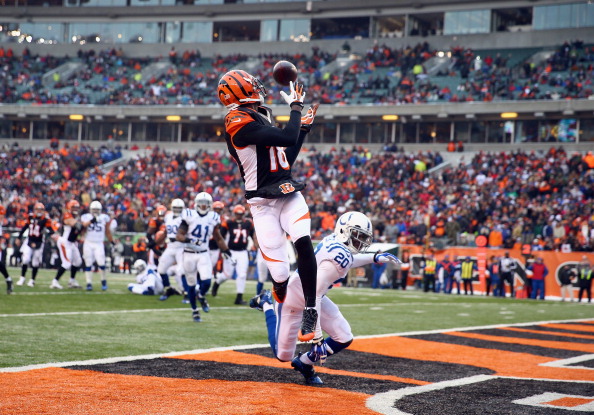 A.J. Green#18  of the Cincinnati Bengals catches a touchdown pass during the NFL game against the Indianapolis Colts  at Paul Brown Stadium on December 8, 2013 in Cincinnati, Ohio.  (Photo by Andy Lyons/Getty Images)